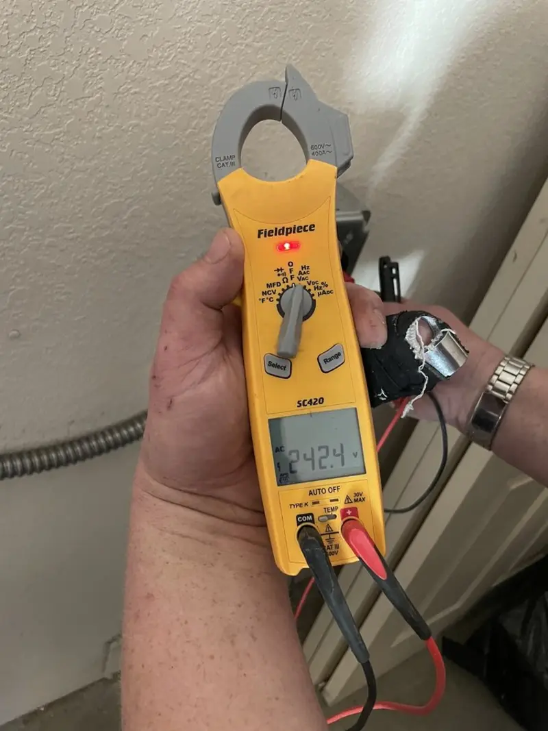 Voltage testing with clamp meter during Ceiling Fan Installation in Scaggsville